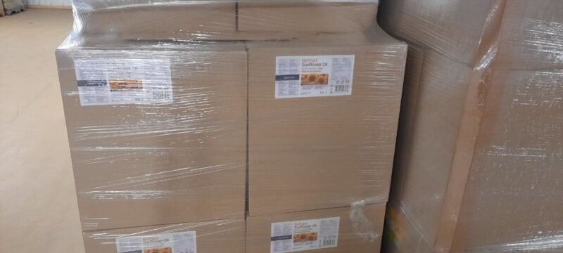 Sunflower oil bottles packed into boxes by 2