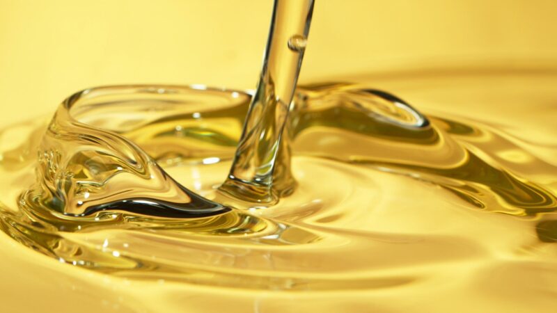 Freeze motion of pouring refined sunflower oil.